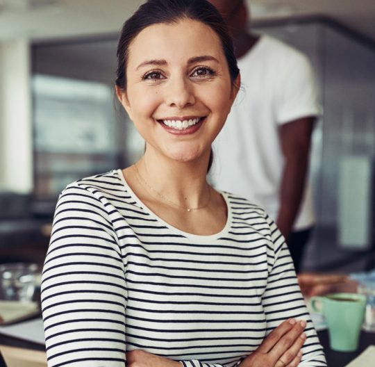 smiling-young-businesswoman-sitting-with