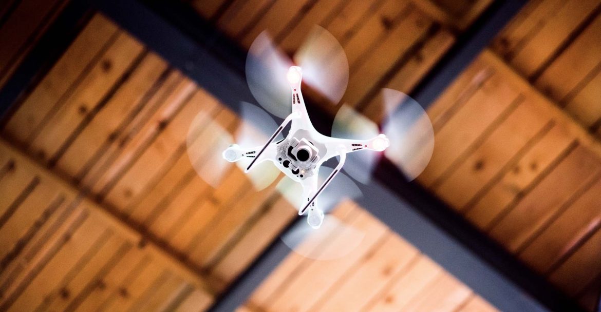 white-drone-flying-inside-the-building-PBW66A6
