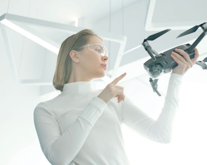 woman-with-modern-drone-G8NRETR
