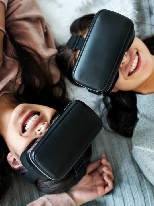 women-experiencing-virtual-reality-with-vr-headset-P8EWPYR