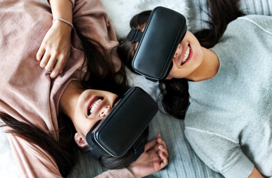 women-experiencing-virtual-reality-with-vr-headset-P8EWPYR