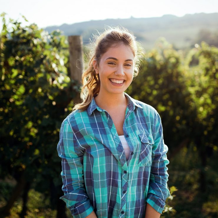woman-winemaker-with-grapes-in-a-vineyard-Y3S6K8Z.jpg