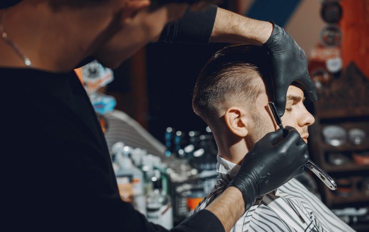 stylish-man-sitting-in-a-barbershop-EYR3SFA