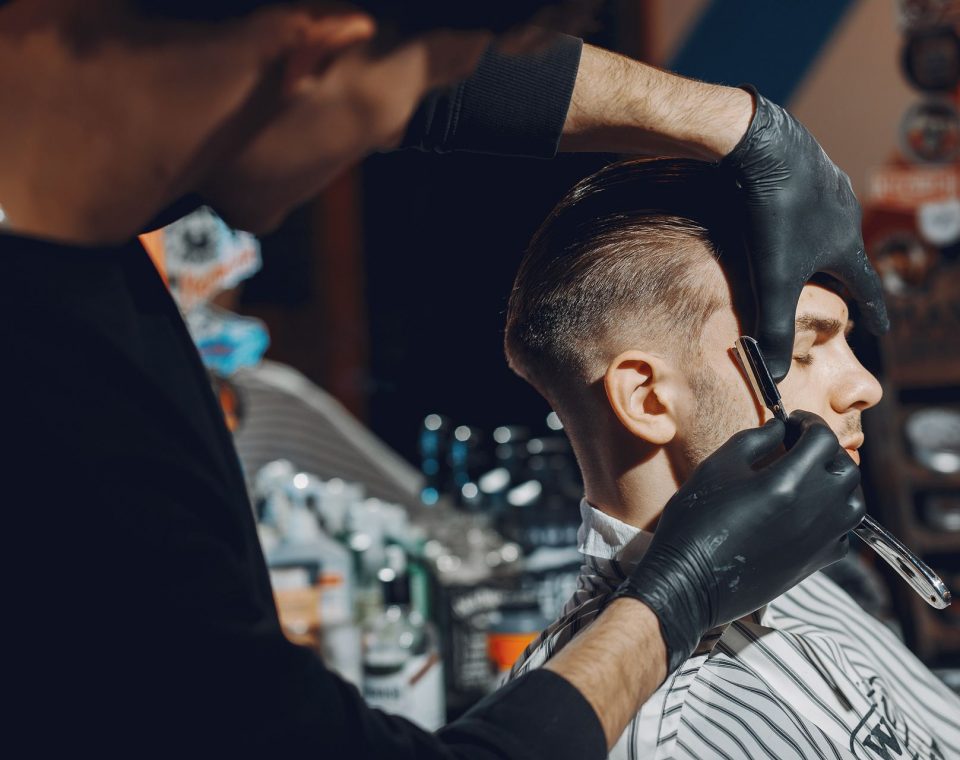 stylish-man-sitting-in-a-barbershop-EYR3SFA